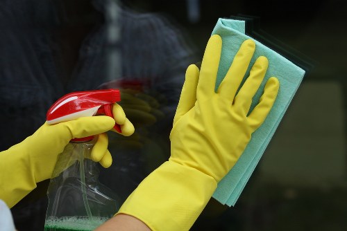 Cleaner preparing a service booking and quotation documents